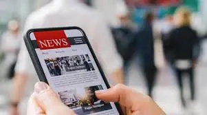 Reader scrolling reliable news daily updates on smartphone screen with clear articles